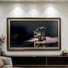 a large framed painting of a tiger walking on a beach at night, with the tiger's reflection visible in the water.