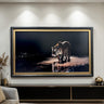 a large framed painting of a tiger walking on a beach at night, with the tiger's reflection visible in the water.